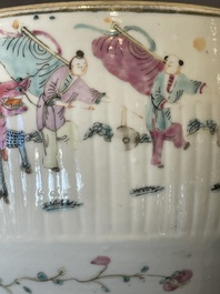 A pair of Chinese famille rose jars and covers with figures in a garden, Tongzhi mark and of the period