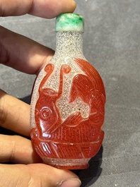 A group of seven Chinese red-overlay glass and red glass snuff bottles, 19/20th C.