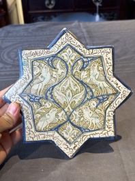 An intact Kashan lustre-glazed star tile, Persia, 13/14th C.