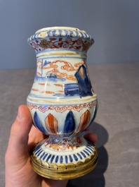 A pair of Chinese Imari-style casters or vases with gilt bronze mounts, Kangxi