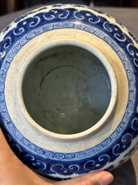 A Chinese blue and white 'flower scroll' jar with a wooden cover, Qianlong