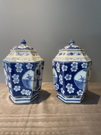 A pair of Chinese blue and white hexagonal jars and covers with a lady holding a fan, 19th C.