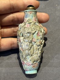 Eight Chinese moulded famille rose snuff bottles, Qianlong mark, 19th C.