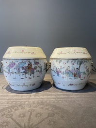 A pair of Chinese famille rose jars and covers with figures in a garden, Tongzhi mark and of the period