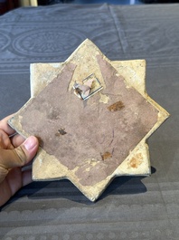 An intact Kashan lustre-glazed star tile, Persia, 13/14th C.