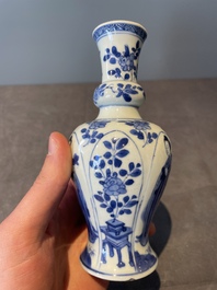 A Chinese blue and white vase, a covered bowl and six saucers, Chenghua and artemisia leaf mark, Kangxi