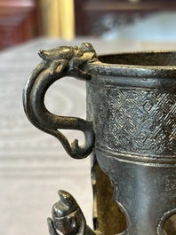 Two Chinese Chinese bronze cylindrical incense stick holders and a covered censer, Yuan/Ming and Qing