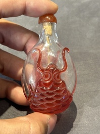 A group of seven Chinese red-overlay glass and red glass snuff bottles, 19/20th C.