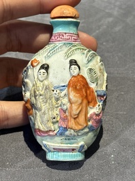 Eight Chinese moulded famille rose snuff bottles, Qianlong mark, 19th C.
