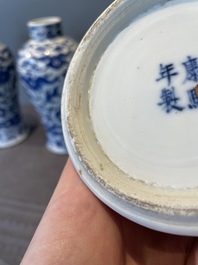 A Chinese blue and white garniture of five vases with lotus scrolls, 19th C.