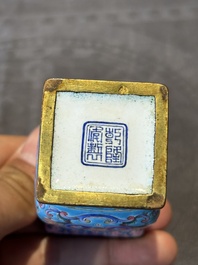 A Chinese Canton enamel 'gu' vase with floral design, Qianlong mark and of the period