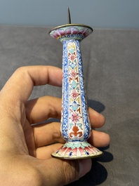 A pair of Chinese Canton enamel candlesticks with floral design, Yongzheng/Qianlong