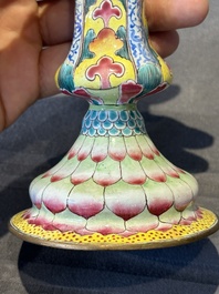 A pair of Chinese Canton enamel 'lotus' candlesticks, Yongzheng