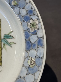 A fine Chinese famille rose 'ruby back' plate with a bird on a blossoming branch, Yongzheng