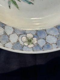 A fine Chinese famille rose 'ruby back' plate with a bird on a blossoming branch, Yongzheng