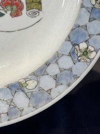 A fine Chinese famille rose 'ruby back' plate with a bird on a blossoming branch, Yongzheng