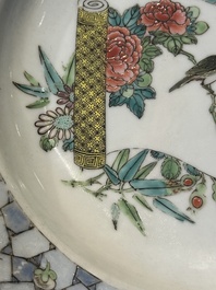 A fine Chinese famille rose 'ruby back' plate with a bird on a blossoming branch, Yongzheng