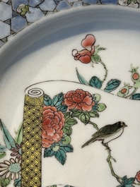 A fine Chinese famille rose 'ruby back' plate with a bird on a blossoming branch, Yongzheng