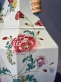 A pair of hexagonal Chinese famille rose 'hu' vases with floral design, Qianlong/Jiaqing