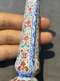 A pair of Chinese Canton enamel candlesticks with floral design, Yongzheng/Qianlong