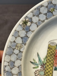 A fine Chinese famille rose 'ruby back' plate with a bird on a blossoming branch, Yongzheng