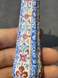 A pair of Chinese Canton enamel candlesticks with floral design, Yongzheng/Qianlong