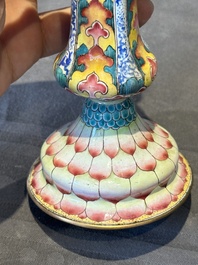 A pair of Chinese Canton enamel 'lotus' candlesticks, Yongzheng