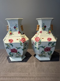 A pair of hexagonal Chinese famille rose 'hu' vases with floral design, Qianlong/Jiaqing