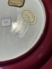 A fine Chinese famille rose 'ruby back' plate with a bird on a blossoming branch, Yongzheng