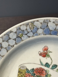 A fine Chinese famille rose 'ruby back' plate with a bird on a blossoming branch, Yongzheng