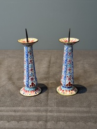 A pair of Chinese Canton enamel candlesticks with floral design, Yongzheng/Qianlong