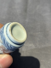 A Chinese blue, white and copper-red 'dragon' snuff bottle, 19th C.
