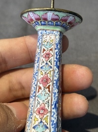 A pair of Chinese Canton enamel candlesticks with floral design, Yongzheng/Qianlong