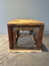 A Chinese rectangular huanghuali wooden stool with 'chilong' design, 17/18th C.