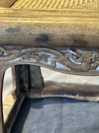 A Chinese rectangular huanghuali wooden stool with 'chilong' design, 17/18th C.