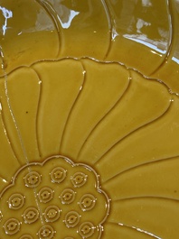 A Chinese yellow-glazed monochrome lotus-shaped dish, Yongzheng mark and of the period