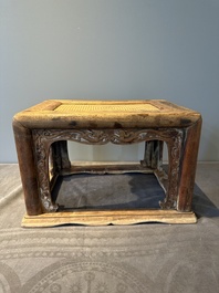 A Chinese rectangular huanghuali wooden stool with 'chilong' design, 17/18th C.
