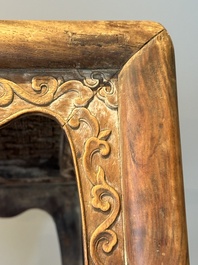 A Chinese rectangular huanghuali wooden stool with 'chilong' design, 17/18th C.