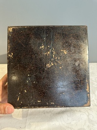 A square Chinese embellished and lacquered wooden box depicting a musician and two boys, Qing