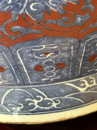 A Chinese blue and white, and iron-red 'bajixiang' 'hu' vase on wooden stand, Qianlong mark, 19th C.