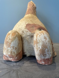 A pair of Chinese polychrome-painted terracotta camels with saddles, Tang