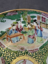A large Chinese Canton famille rose dish and eight plates, 19th C.