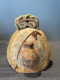 A pair of Chinese polychrome-painted terracotta camels with saddles, Tang