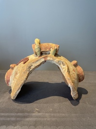 A pair of Chinese polychrome-painted terracotta camels with saddles, Tang