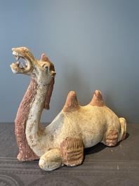 A pair of Chinese polychrome-painted terracotta camels with saddles, Tang