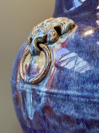 A large Chinese flamb&eacute; glaze 'hu' vase with Taotie handles, Qing