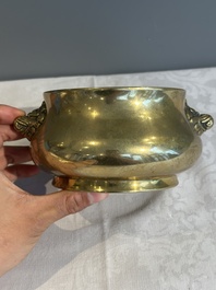 A Chinese bronze elephant-head-handled censer, Xuande mark, Kangxi/Qianlong