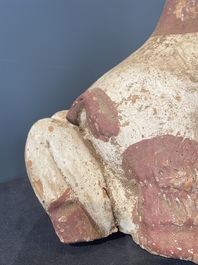 A pair of Chinese polychrome-painted terracotta camels with saddles, Tang