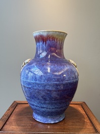 A large Chinese flamb&eacute; glaze 'hu' vase with Taotie handles, Qing