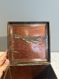 A square Chinese embellished and lacquered wooden box depicting a musician and two boys, Qing